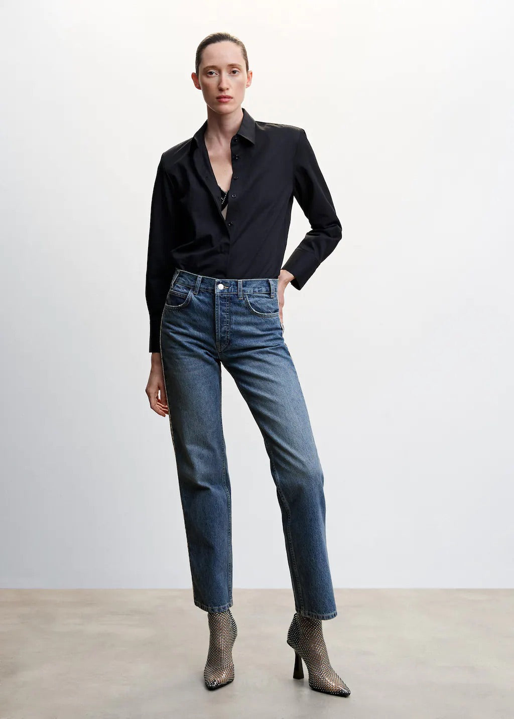 Straight jeans with crystal detail on the sides