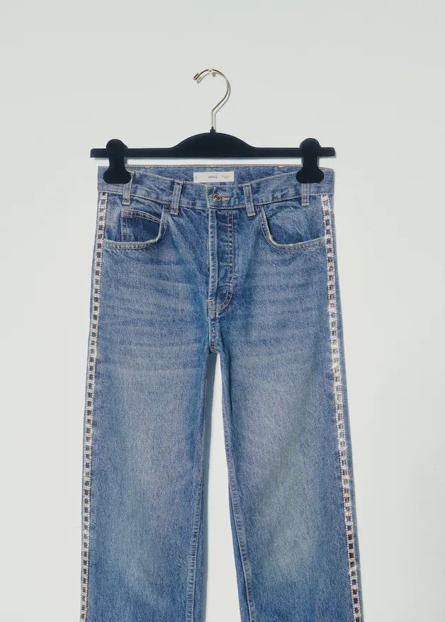 Straight jeans with crystal detail on the sides