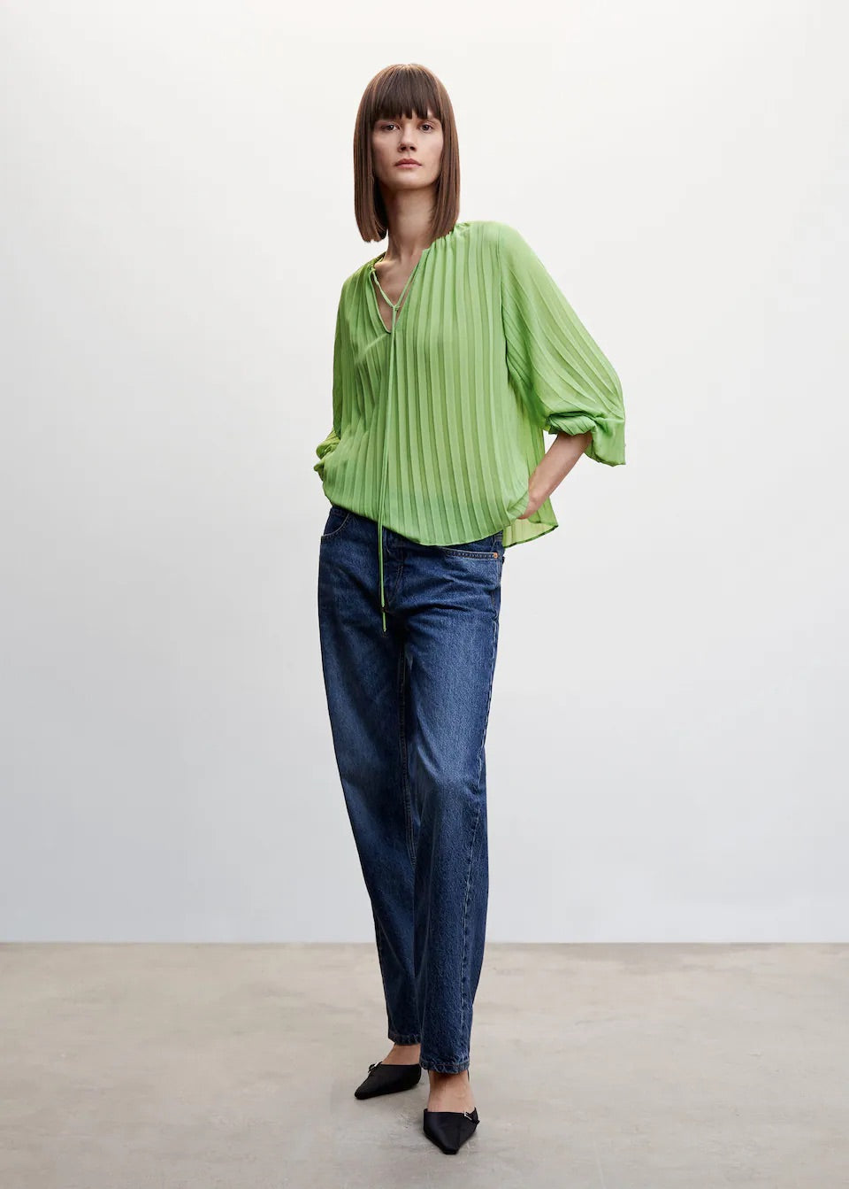 Pleated blouse with puffed sleeves