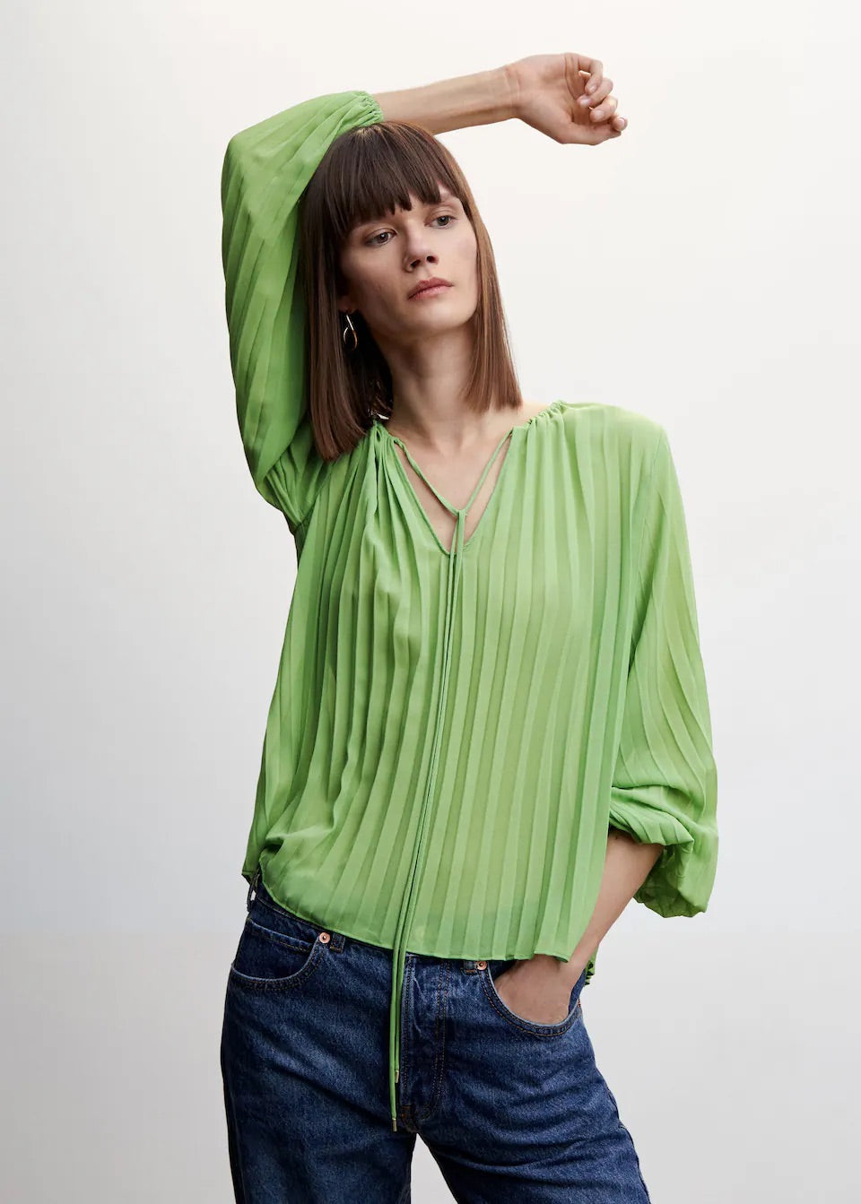 Pleated blouse with puffed sleeves