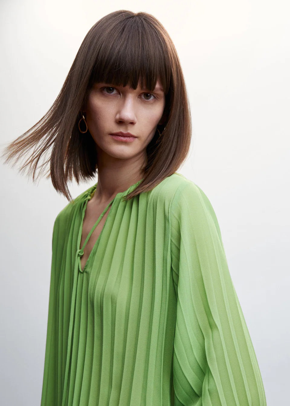 Pleated blouse with puffed sleeves