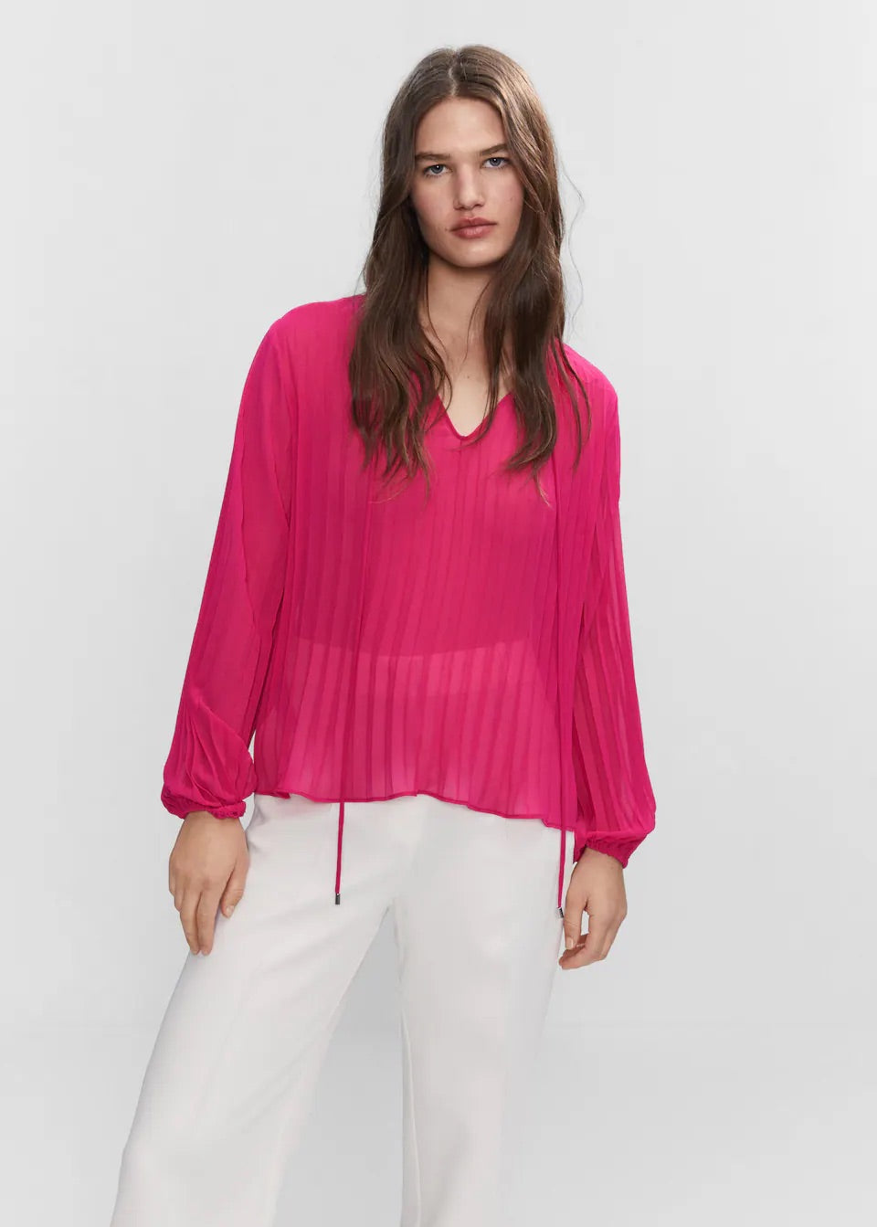 Pleated blouse with puffed sleeves