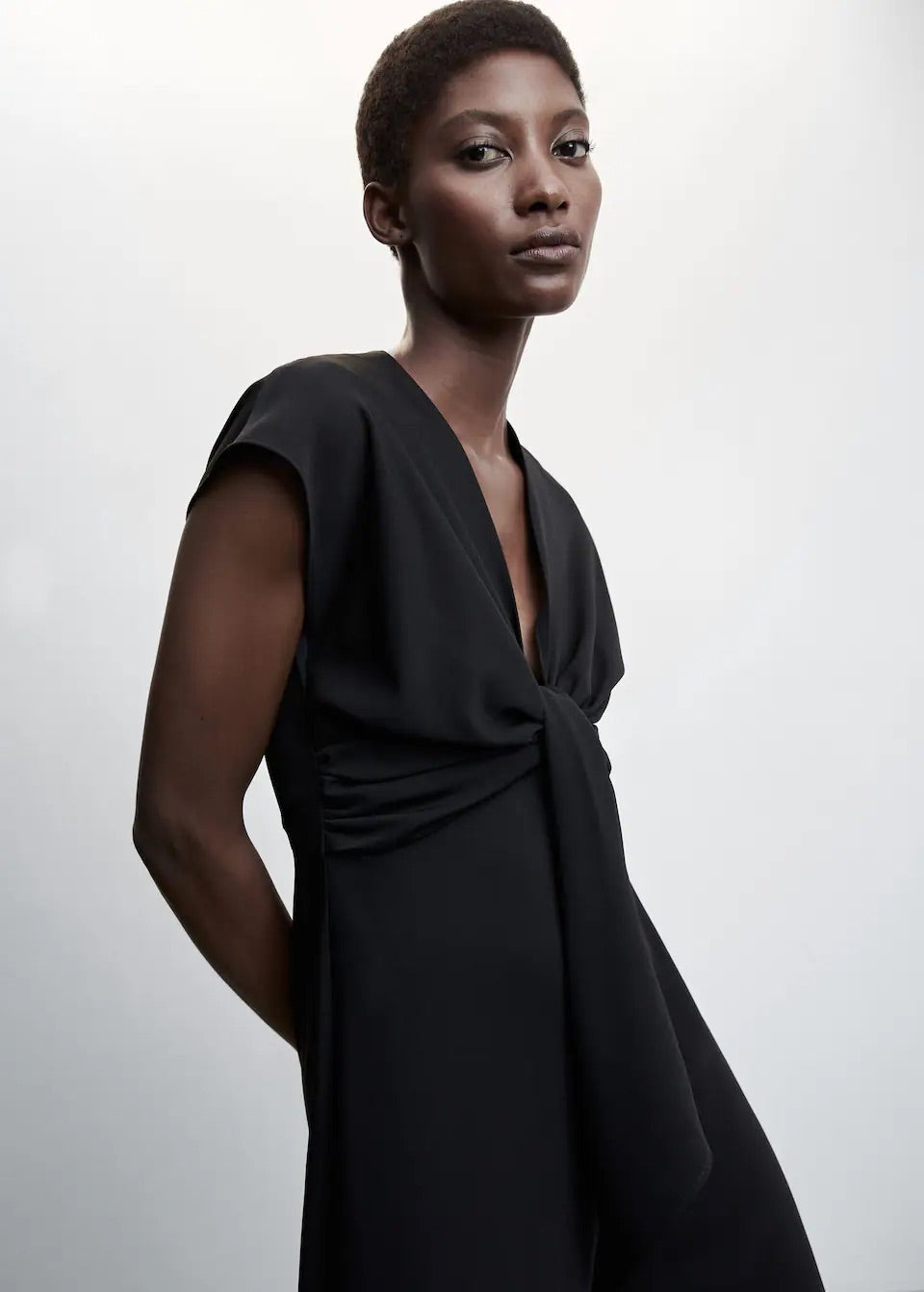 Short-sleeved jumpsuit with knot detail