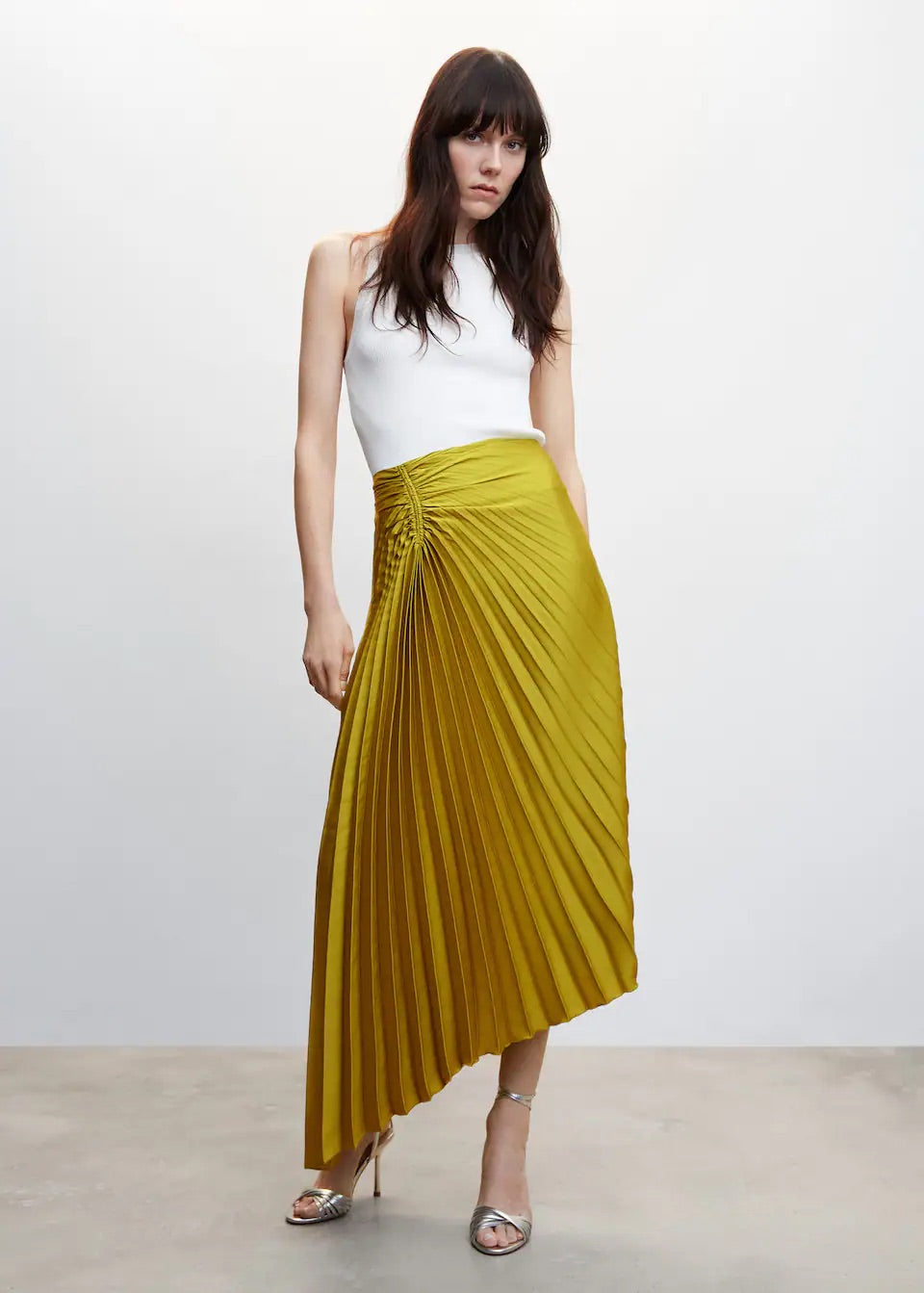 Pleated asymmetric skirt