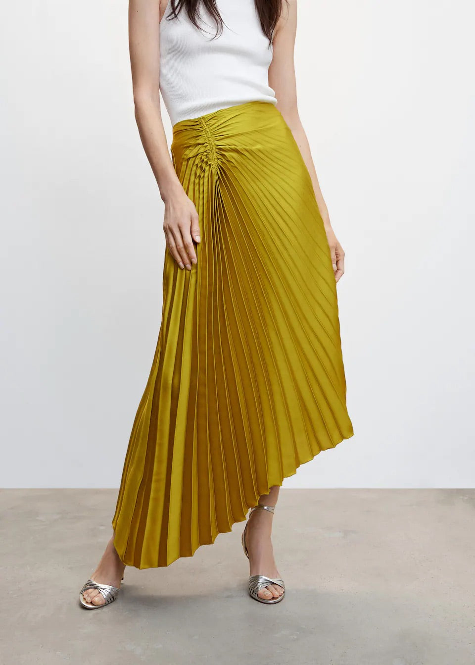 Pleated asymmetric skirt