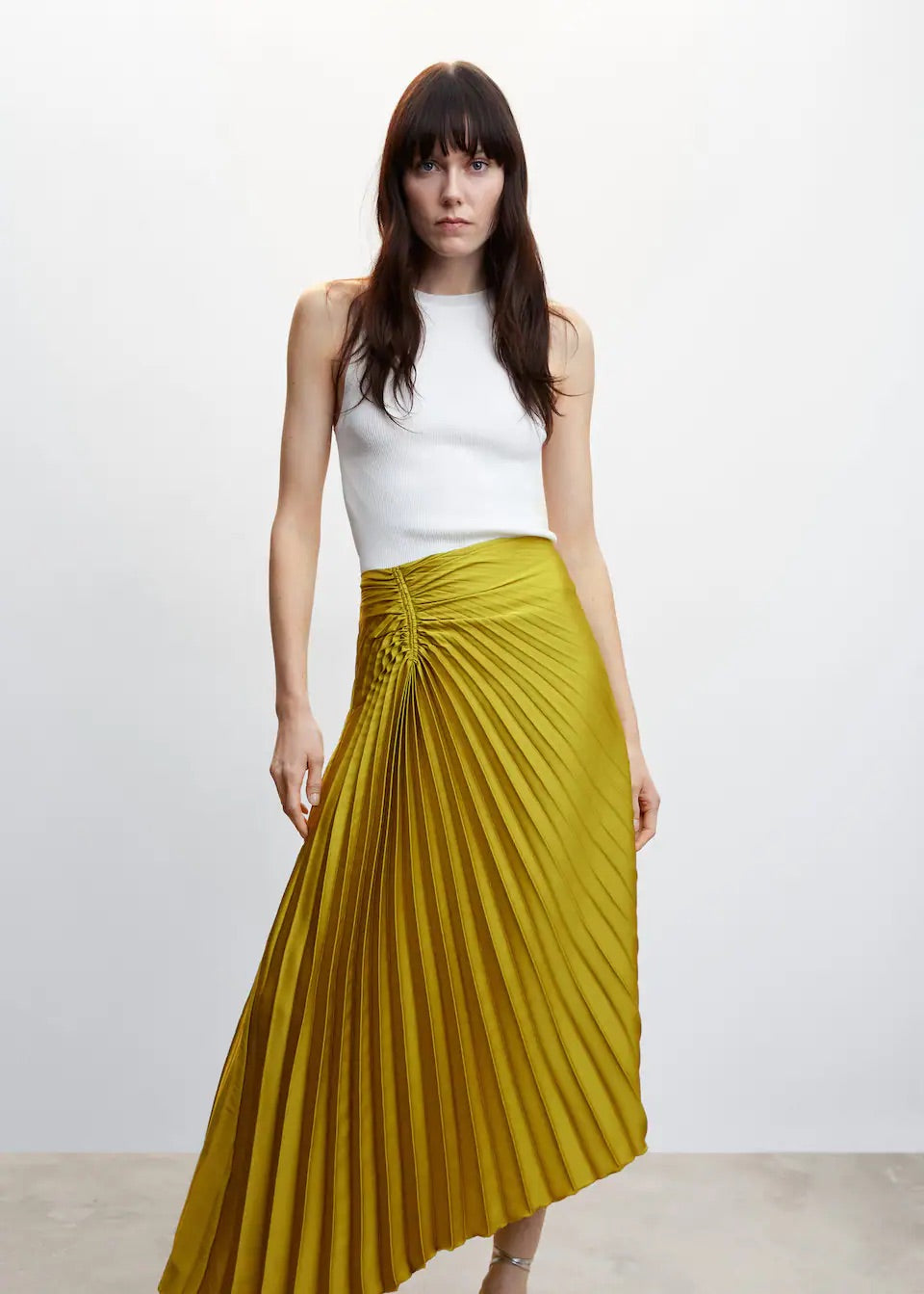 Pleated asymmetric skirt