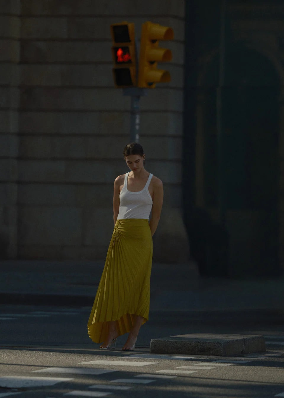Pleated asymmetric skirt