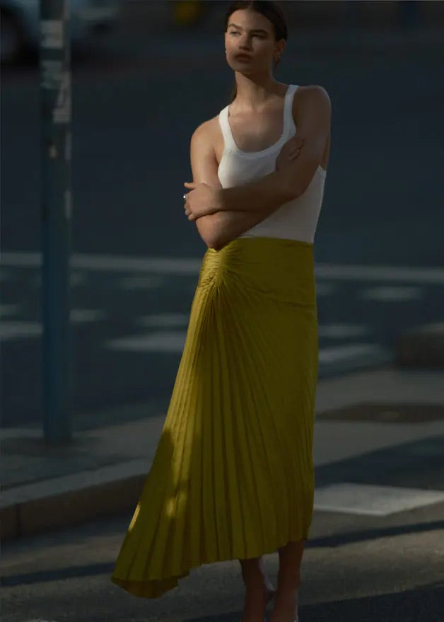 Pleated asymmetric skirt