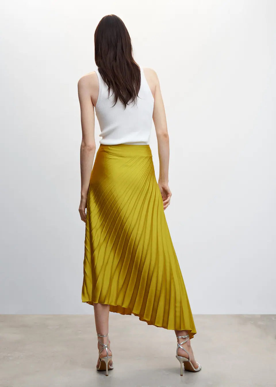 Pleated asymmetric skirt