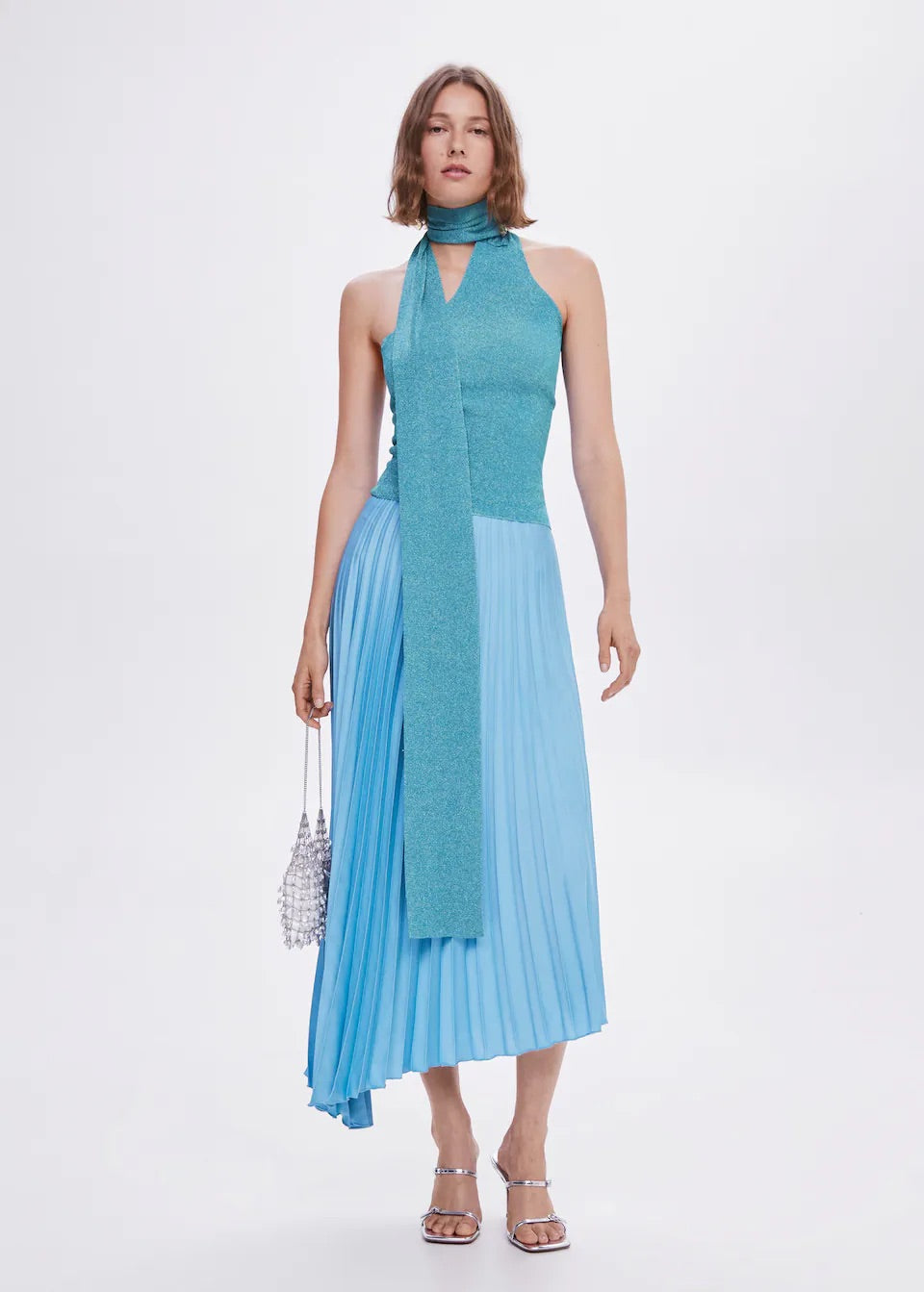 Pleated asymmetric skirt