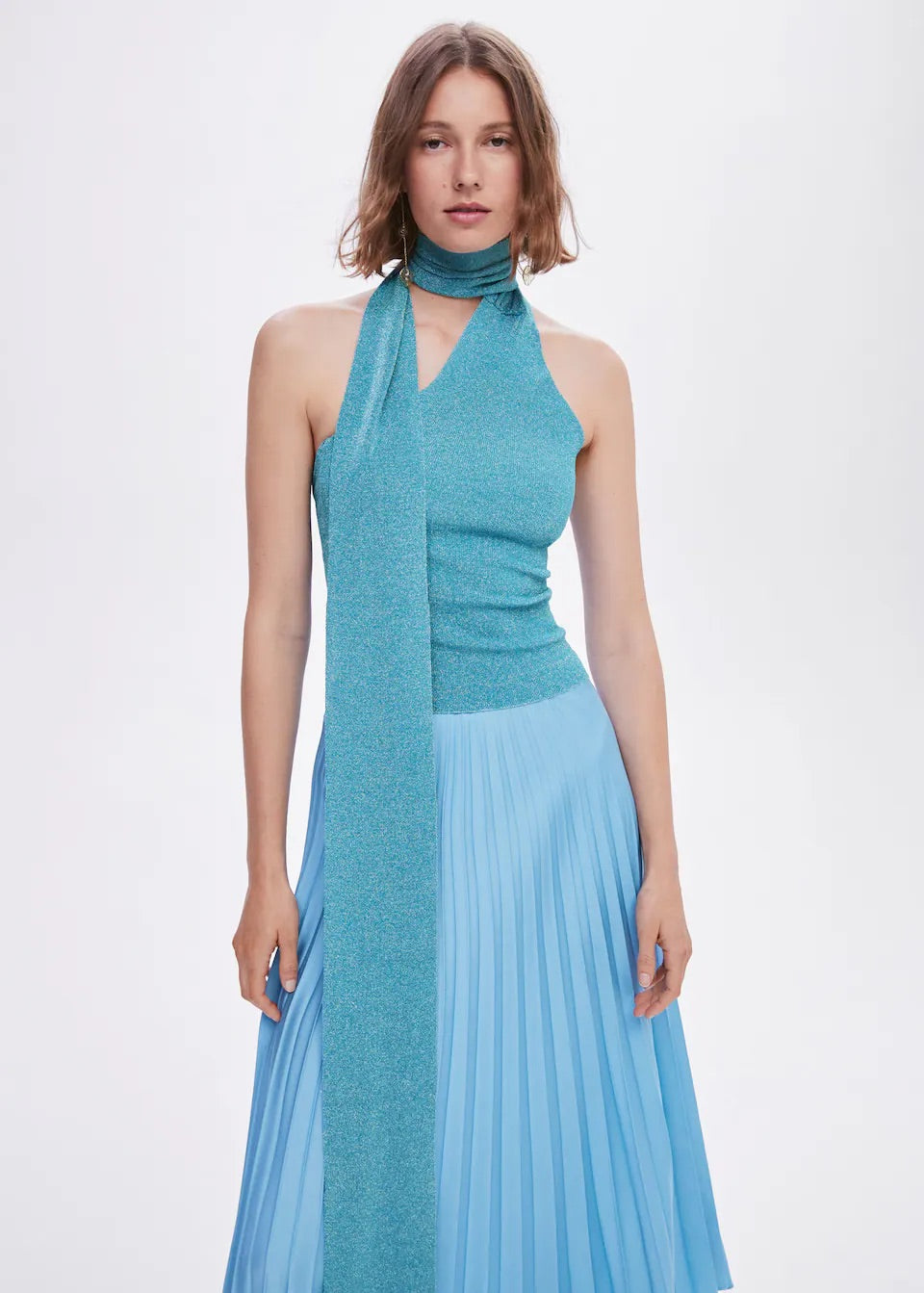 Pleated asymmetric skirt
