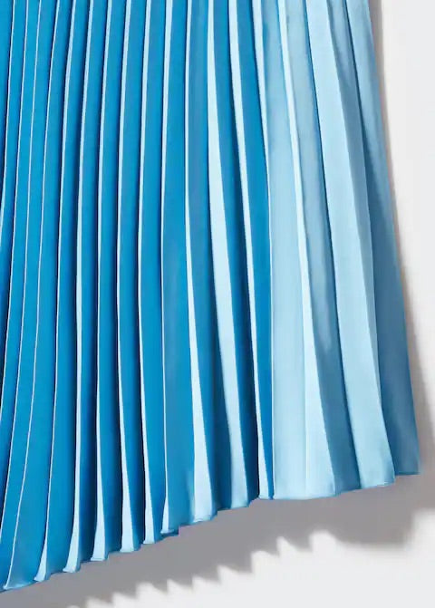 Pleated asymmetric skirt