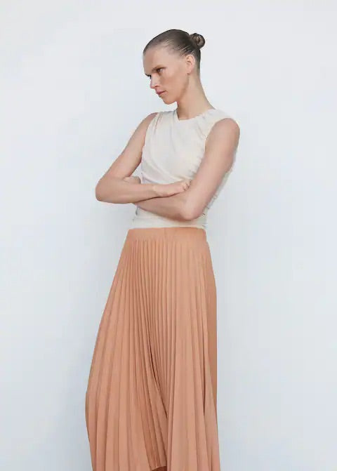 Pleated asymmetric skirt