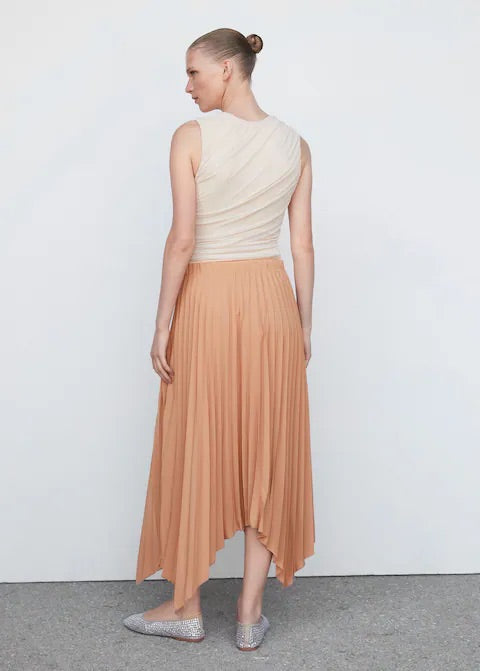 Pleated asymmetric skirt