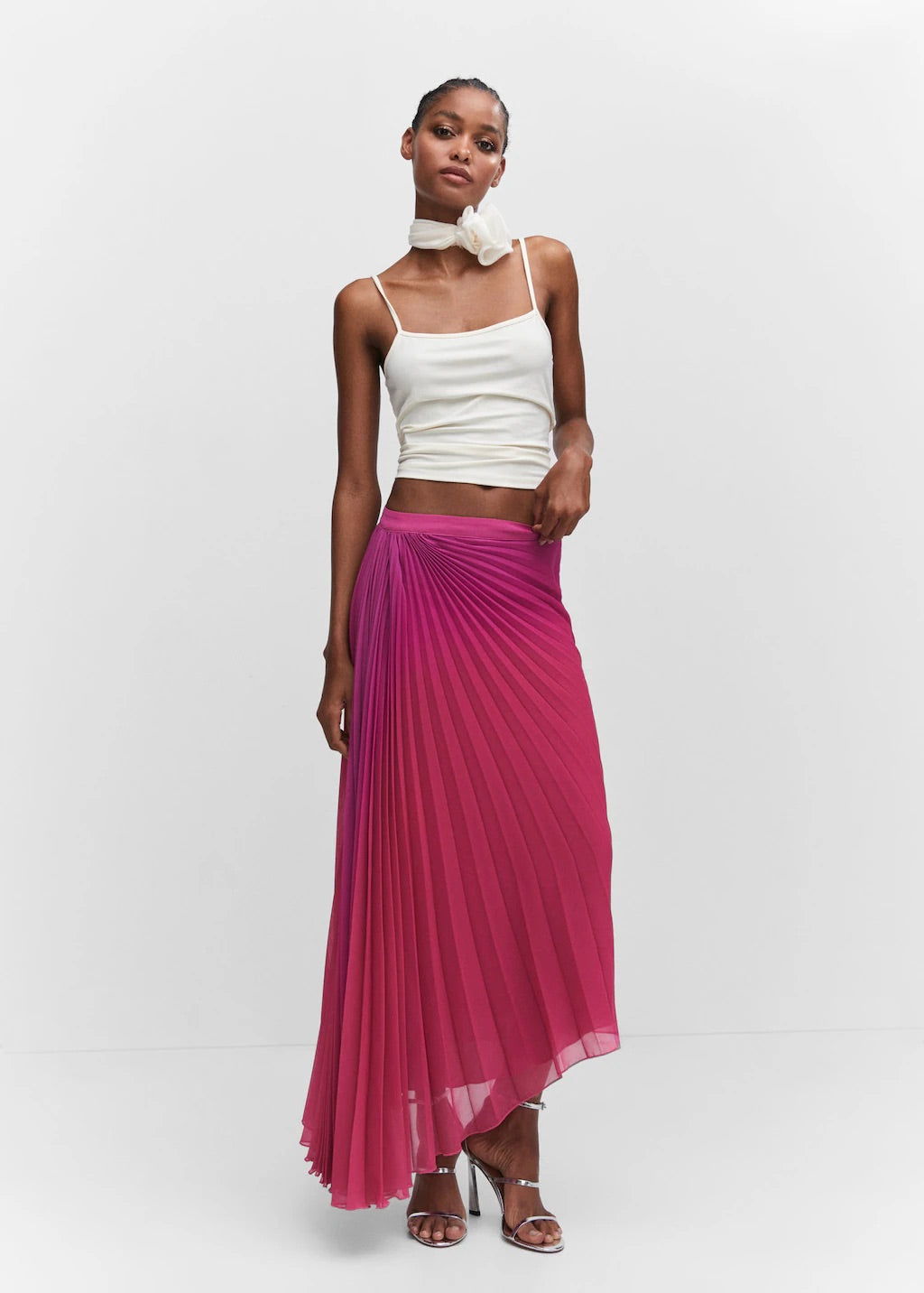 Pleated asymmetric skirt