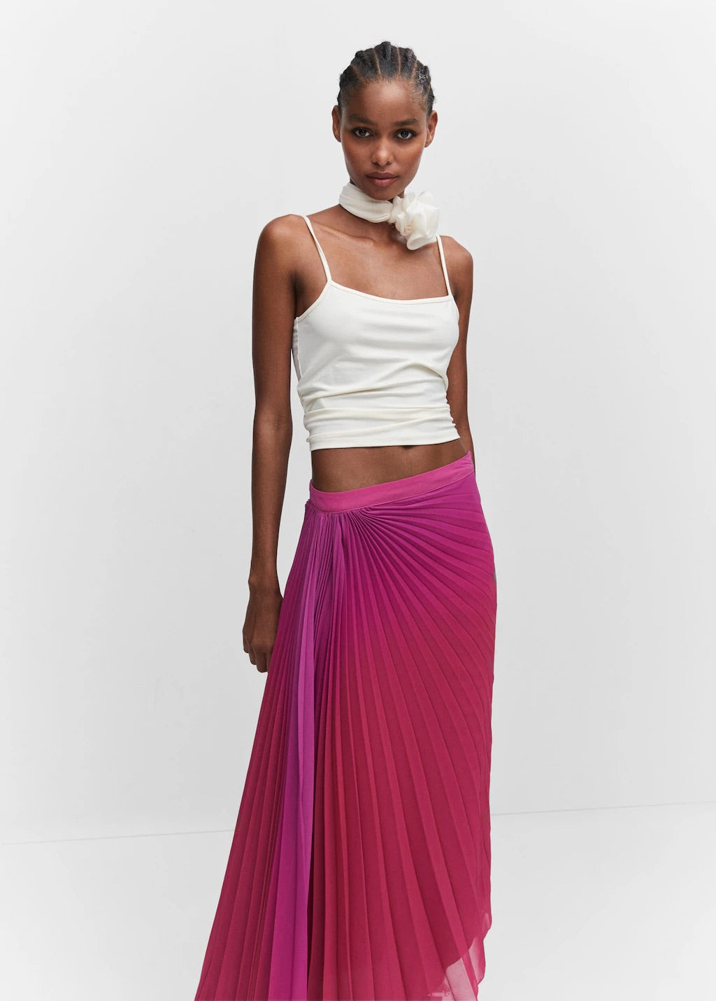 Pleated asymmetric skirt