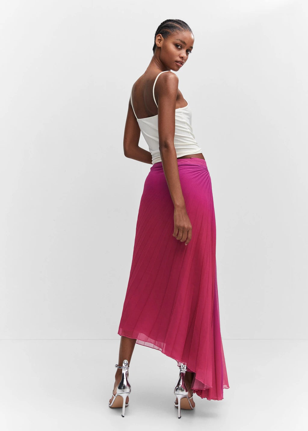 Pleated asymmetric skirt